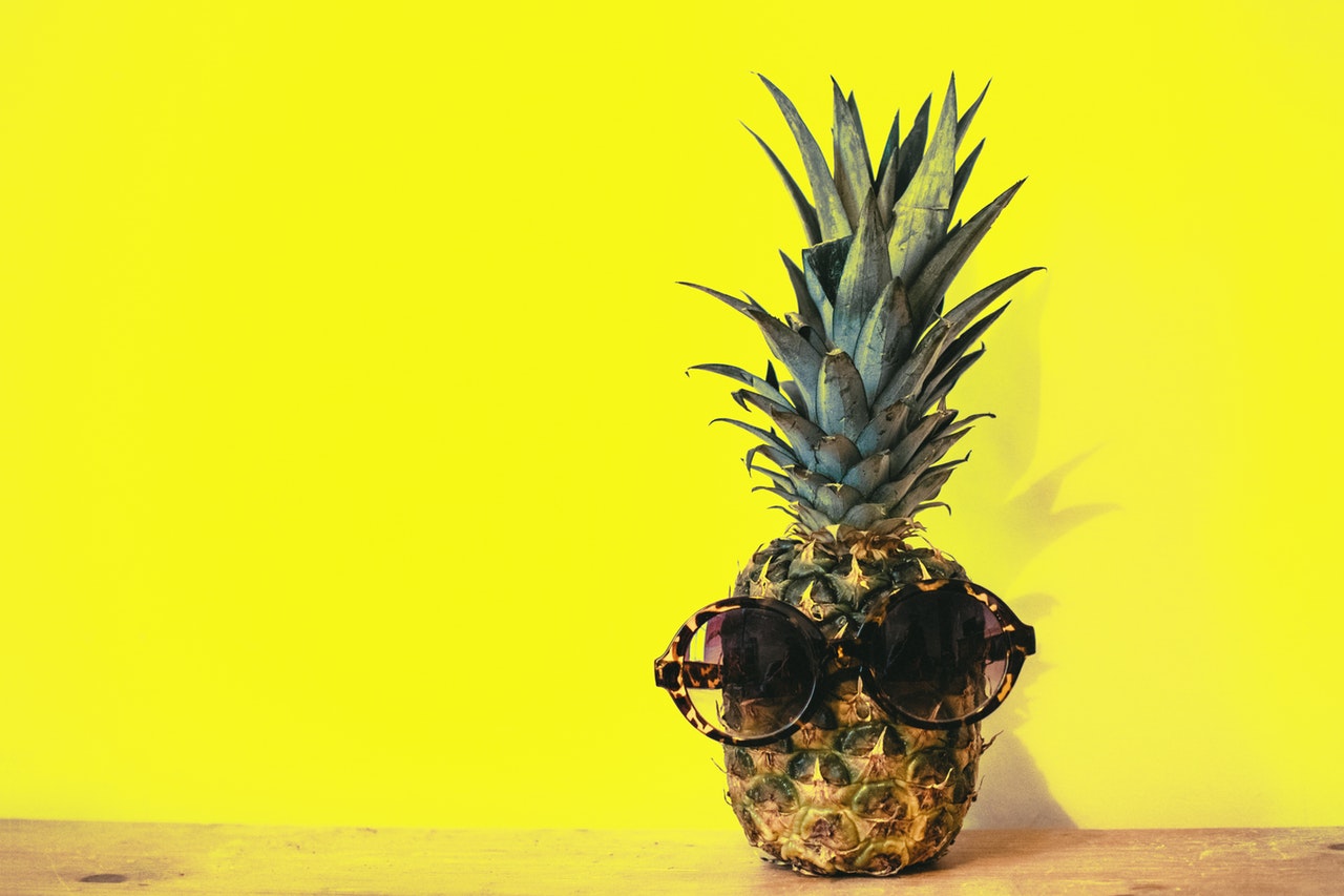 green-pineapple-fruit-with-brown-framed-sunglasses-beside-1161547 (med)