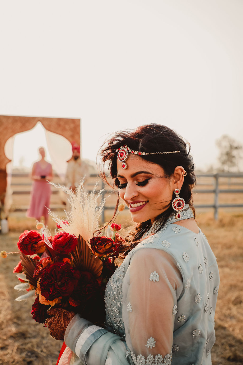 Indian bride holding bouquet