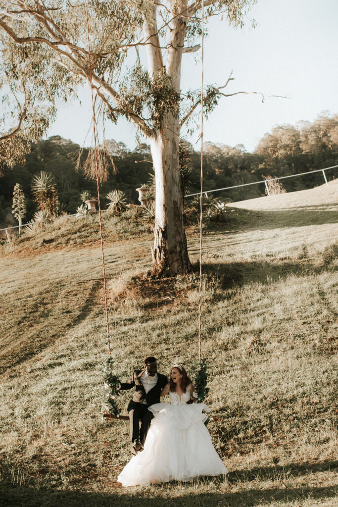 wedding planning tip bride and groom on a swing
