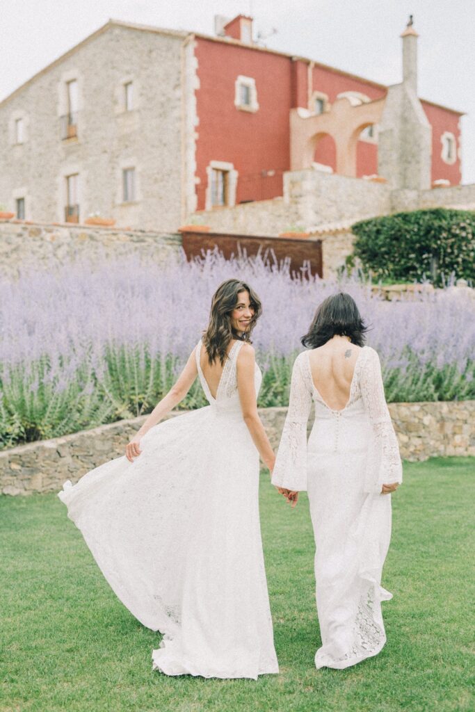 Two brides walking through lavender - wedding day timeline